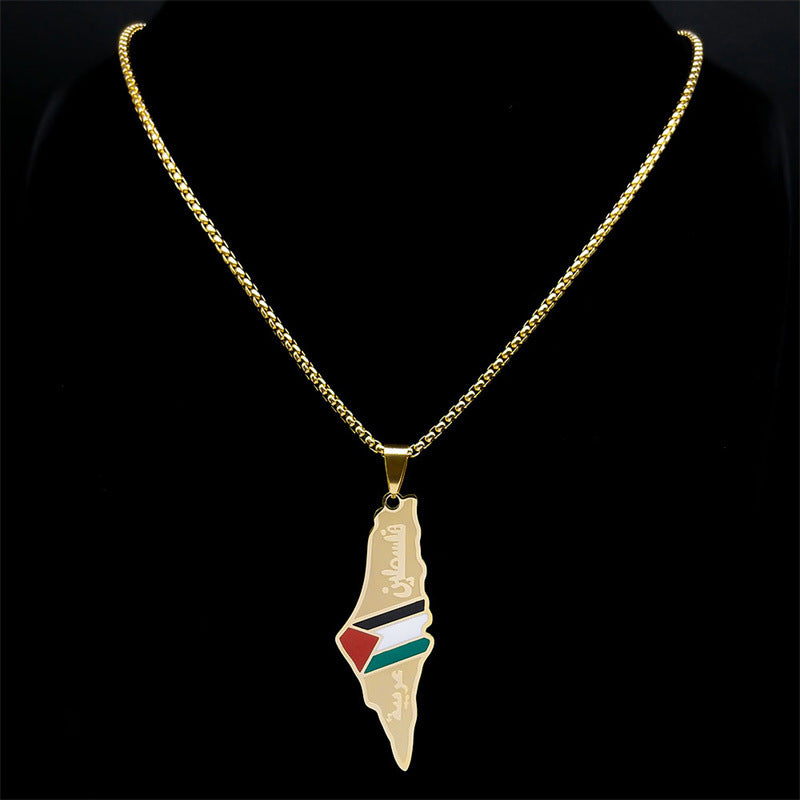 Gold-tone map pendant necklace with Palestinian flag colors and Arabic engraving on a black display