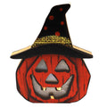 Orange pumpkin-face decoration with a black witch hat, red dots and a gold-coloured hatband, shown on white.
