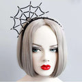 Black spiderweb Halloween headband displayed on a wigged mannequin