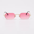 Polygonal rimless sunglasses with pink gradient lenses and a gold-tone bridge