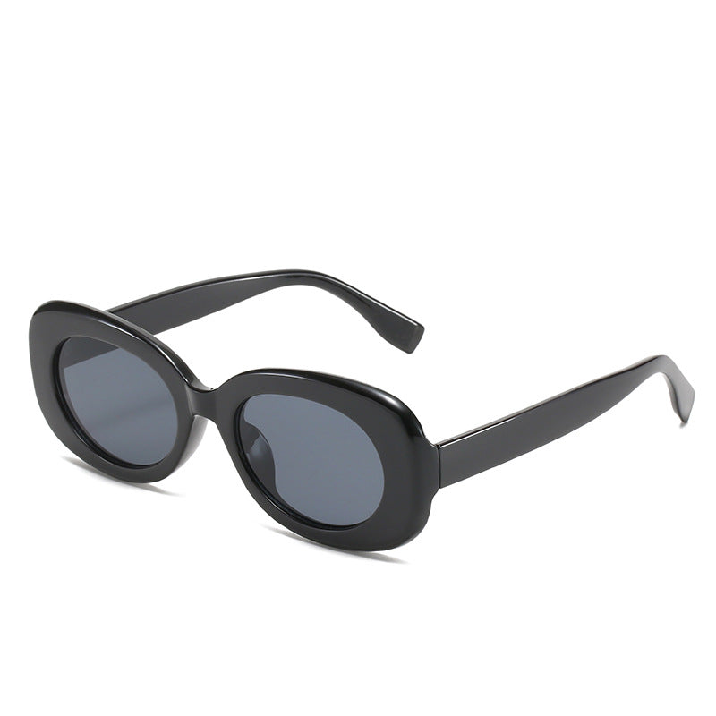 Black oval sunglasses with dark lenses and wide arms on white.