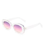 Transparent oval sunglasses with pink-gradient lenses on white.