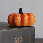 Short orange pumpkin-shaped decorative light shown unlit
