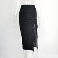 Black ruched midi skirt with a drawstring slit, shown on a transparent mannequin — front view