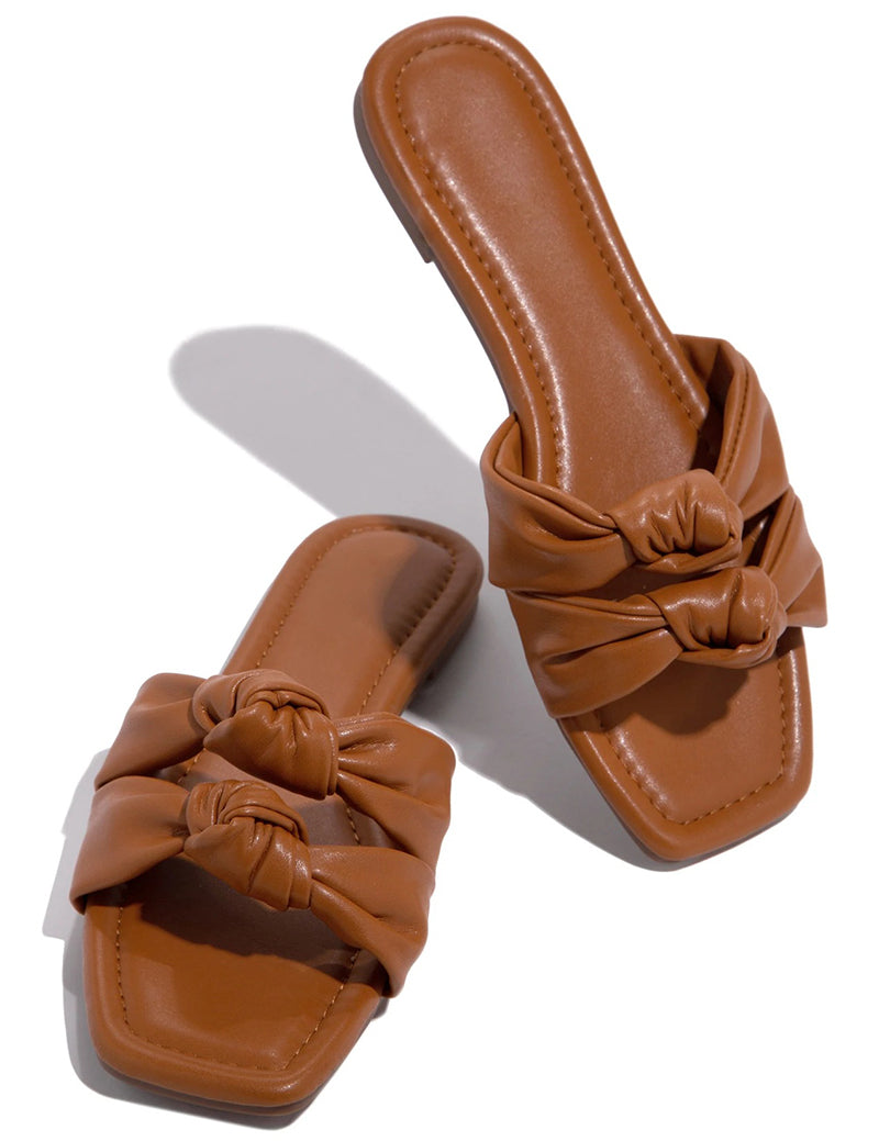 Brown flat slides with two knot-detail straps