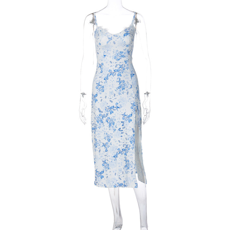 White dress with blue floral print, lace-trim neckline, thin straps and a side slit, shown on a transparent mannequin.