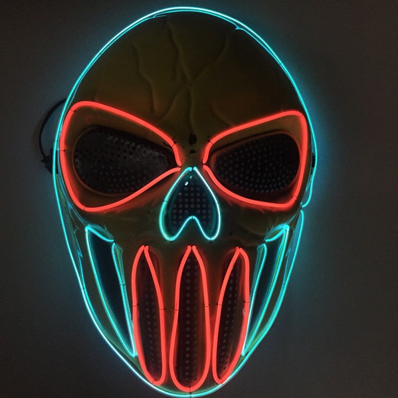 Skull-style costume mask shown illuminated from the front, with blue outline lights and red eye and mouth outlines.