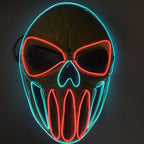 Skull-style costume mask shown illuminated from the front, with blue outline lights and red eye and mouth outlines.