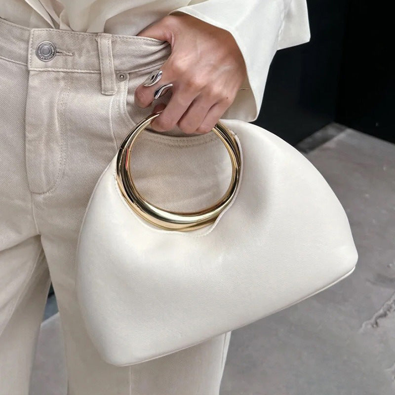White evening bag with gold-tone ring handles