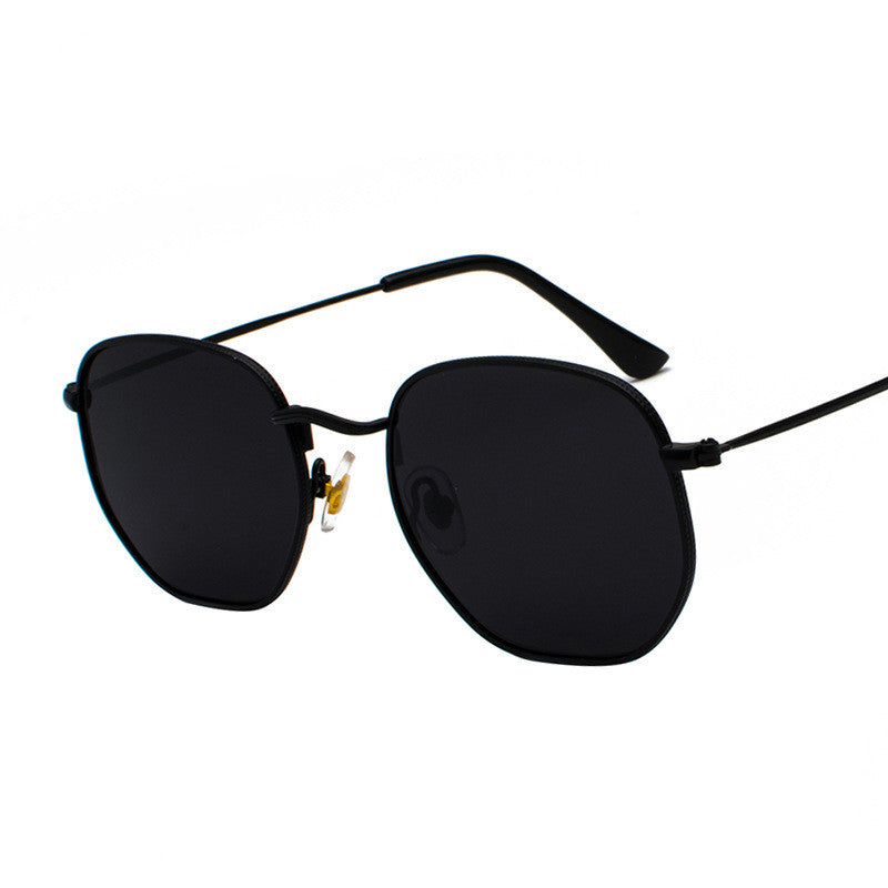 Rounded-square glasses with dark lenses and thin arms on a white background