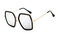 Oversized geometric glasses with a black frame, clear lenses and gold-tone arms on a white background