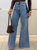 Front view of light-blue high-waist flared jeans with contrast side panels and wide hems