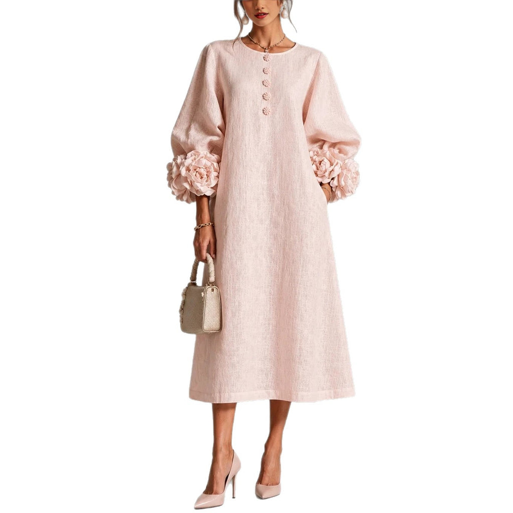 Pink floral-detail midi dress worn front view with floral cuffs and full hem