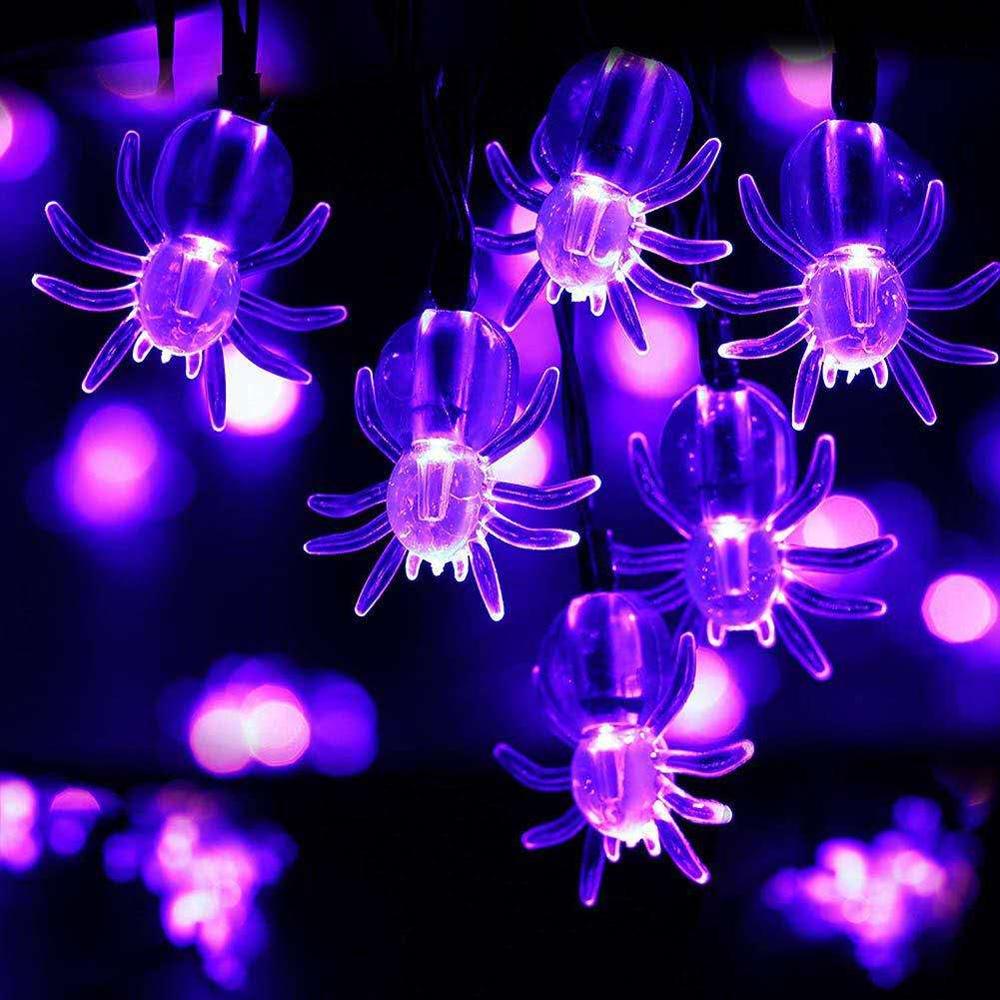 Purple spider-motif Halloween string lights shown illuminated.