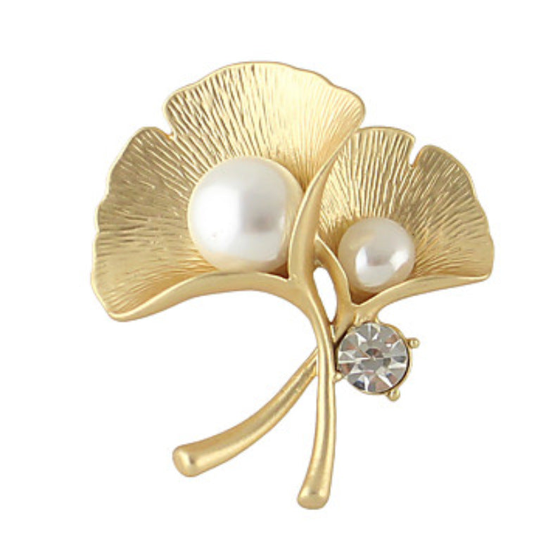 Gold-tone ginkgo leaf brooch with two pearl-look accents