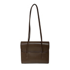 Brown rectangular shoulder bag with a rounded flap and two long narrow shoulder straps.