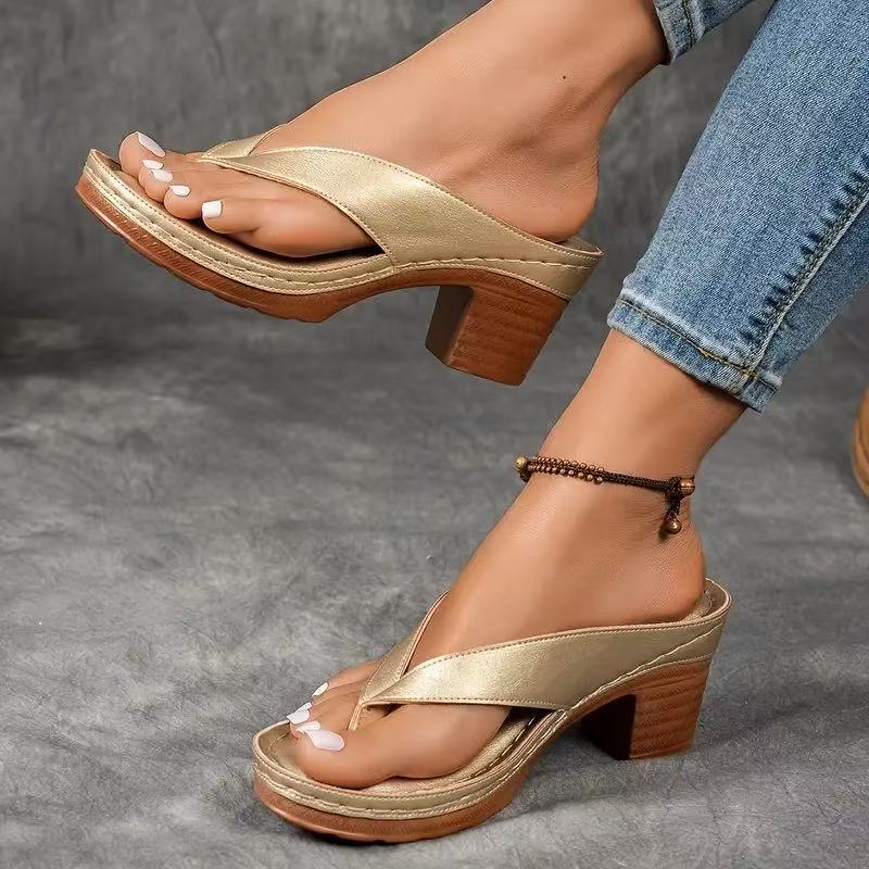Champagne thong slide sandals with block heels.