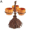 Three-cup Halloween display rack with pumpkin-shaped cups and a broom-style base.