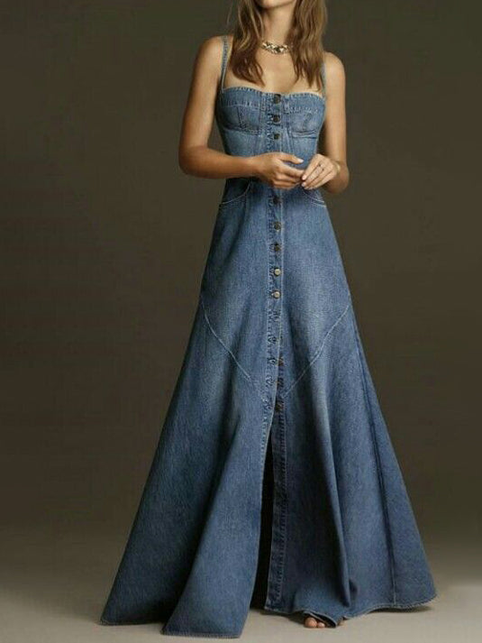 Blue denim maxi dress worn from the front, with narrow straps, button front and flared hem.