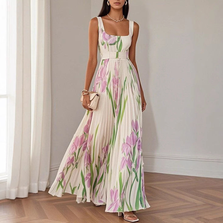 White sleeveless square-neck dress with purple floral artwork and a pleated full-length skirt.