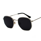 Rounded-square glasses with silver-tone rims and dark lenses on a white background