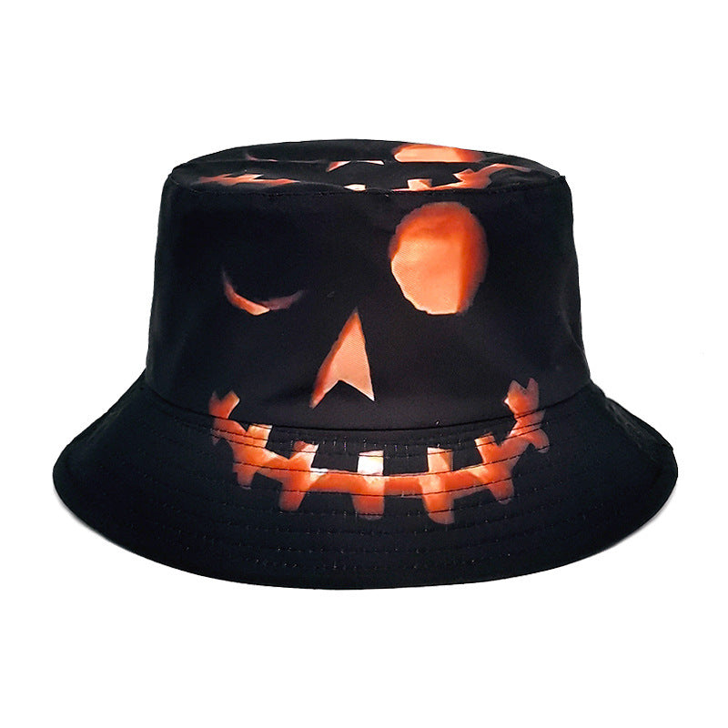 Single black bucket hat with an orange pumpkin-face print