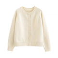Beige round-neck knit cardigan with long sleeves and six front buttons — full front view