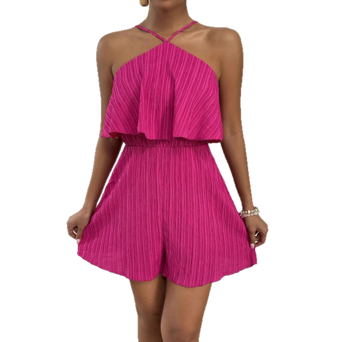 Pink halter-neck romper with a ruffled overlay and loose short legs.