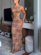 Leopard-print maxi dress shown from the front with a high neckline and floor-length hem.