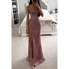 Pink-toned strappy long dress with a gathered neckline and thigh slit, shown worn.