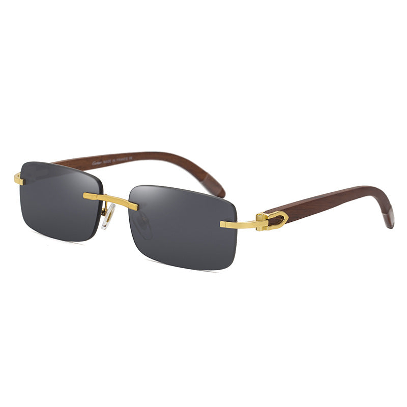 One pair of rimless rectangular sunglasses with black lenses, a gold-tone bridge and brown temples on white