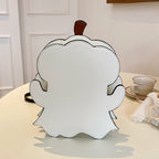 Plain white back of the ghost-shaped bag displayed on a table.