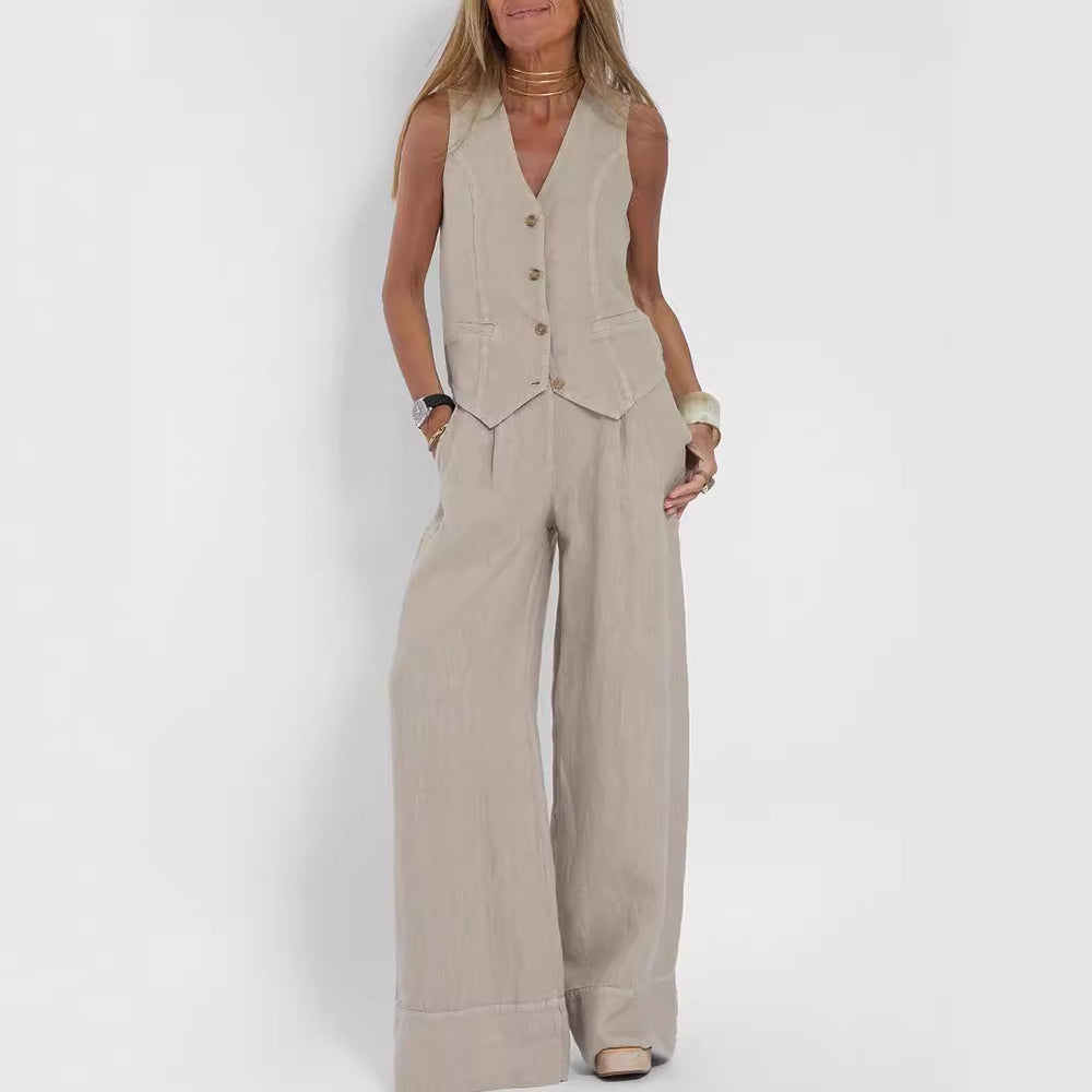 Model wearing a beige sleeveless button-front vest and wide-leg trousers