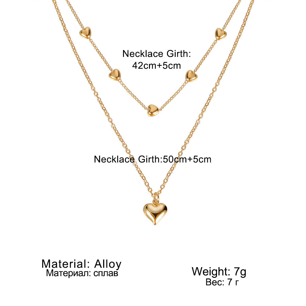 Double-layer heart necklace diagram with supplier measurements and material information.
