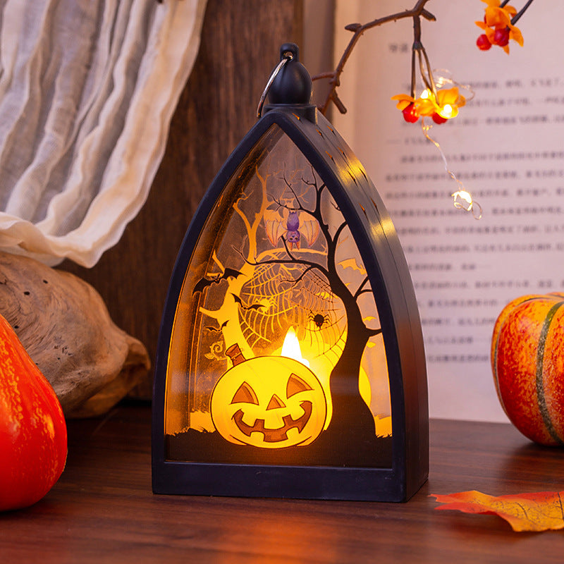 Pumpkin-design Halloween lantern illuminated in a tabletop display.