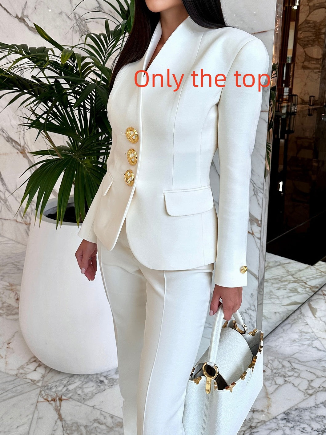 Blazer-only option: ivory single-breasted jacket with three gold-tone front buttons; trousers and handbag shown as styling context