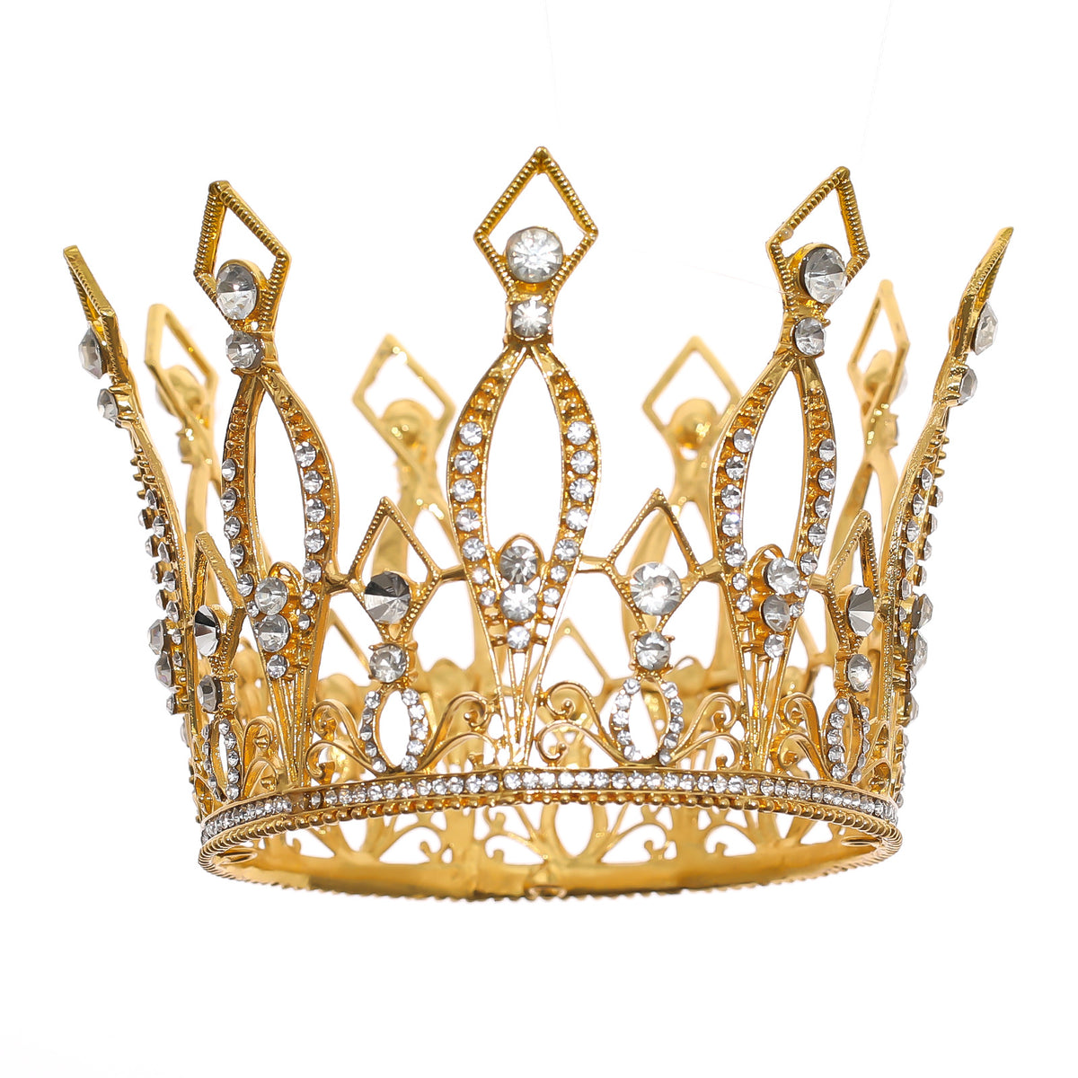 Gold-tone occasion crown with clear decorative stones, close-up on a white background.