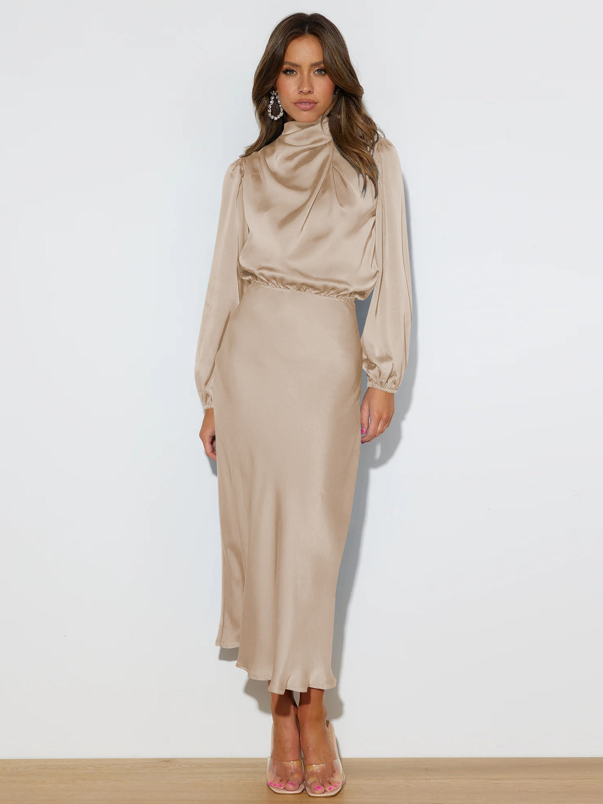 Beige long-sleeve dress with a draped high neckline and gathered waist.