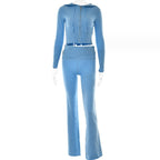 Light blue cropped zip-front hooded top and matching flared trousers with a ribbed foldover waistband, shown on a mannequin.