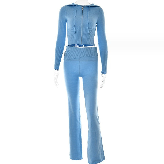 Light blue cropped zip-front hooded top and matching flared trousers with a ribbed foldover waistband, shown on a mannequin.
