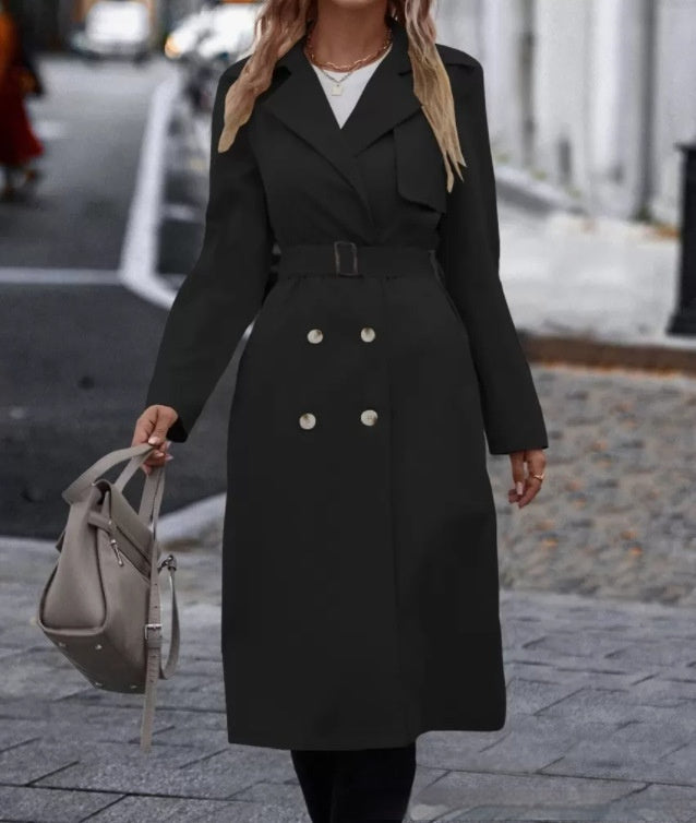 Black 2 double-breasted trench coat with buckle belt shown worn outdoors