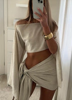 Apricot off-shoulder cropped top and tie-front skirt shown in a mirror photograph.