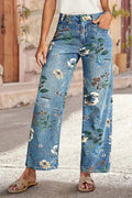 Light-blue floral-print jeans worn by a model outdoors