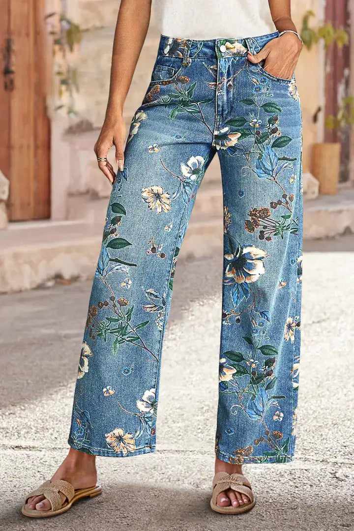 Light-blue floral-print jeans worn by a model outdoors