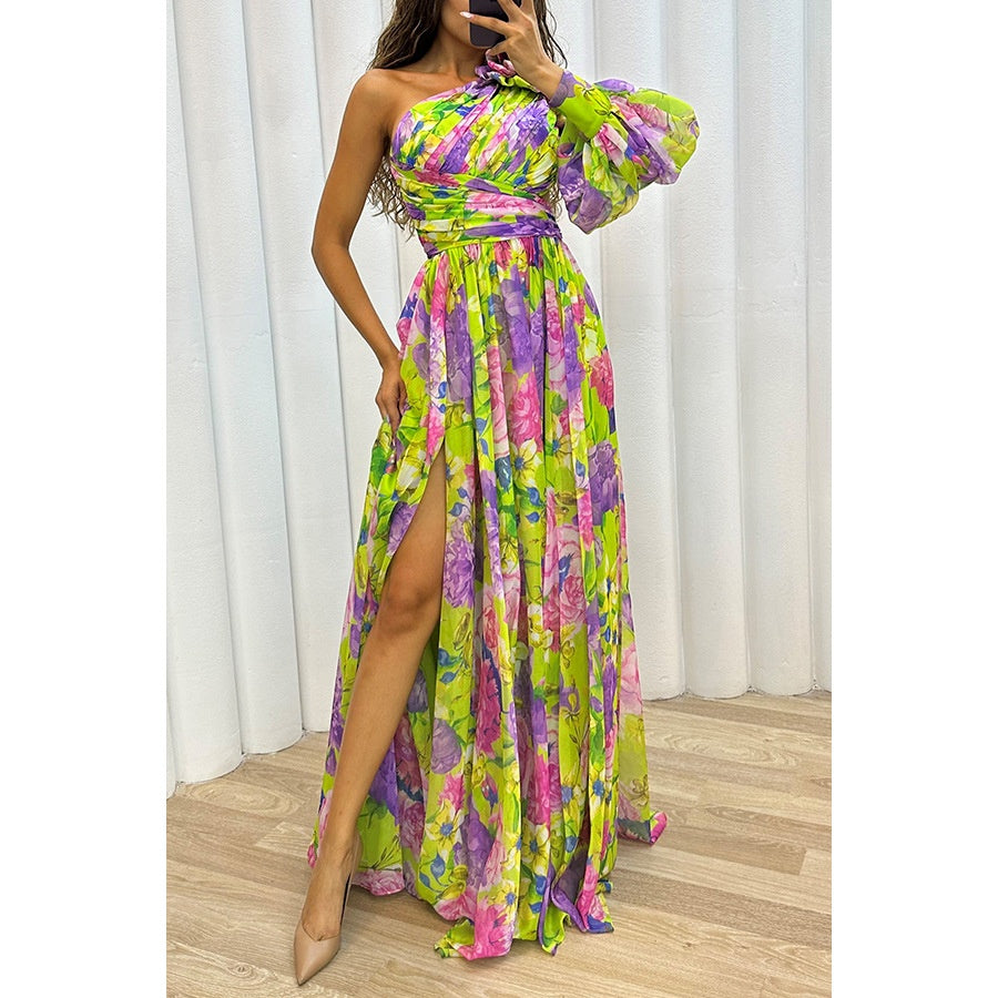 Multicolour floral one-shoulder maxi dress with one long sleeve and a slit, shown worn.