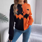Orange-and-black jack-o'-lantern knit sweater worn on a model.