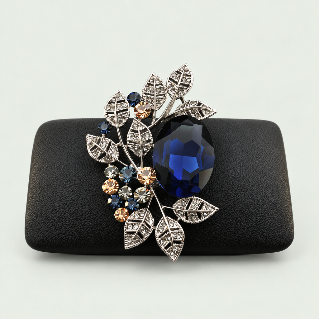 Geometric Statement Brooch in Blue on its display support against pale sage