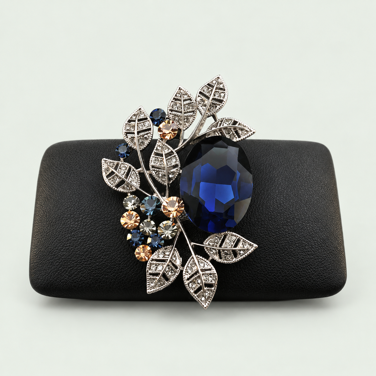 Geometric Statement Brooch in Blue on its display support against pale sage